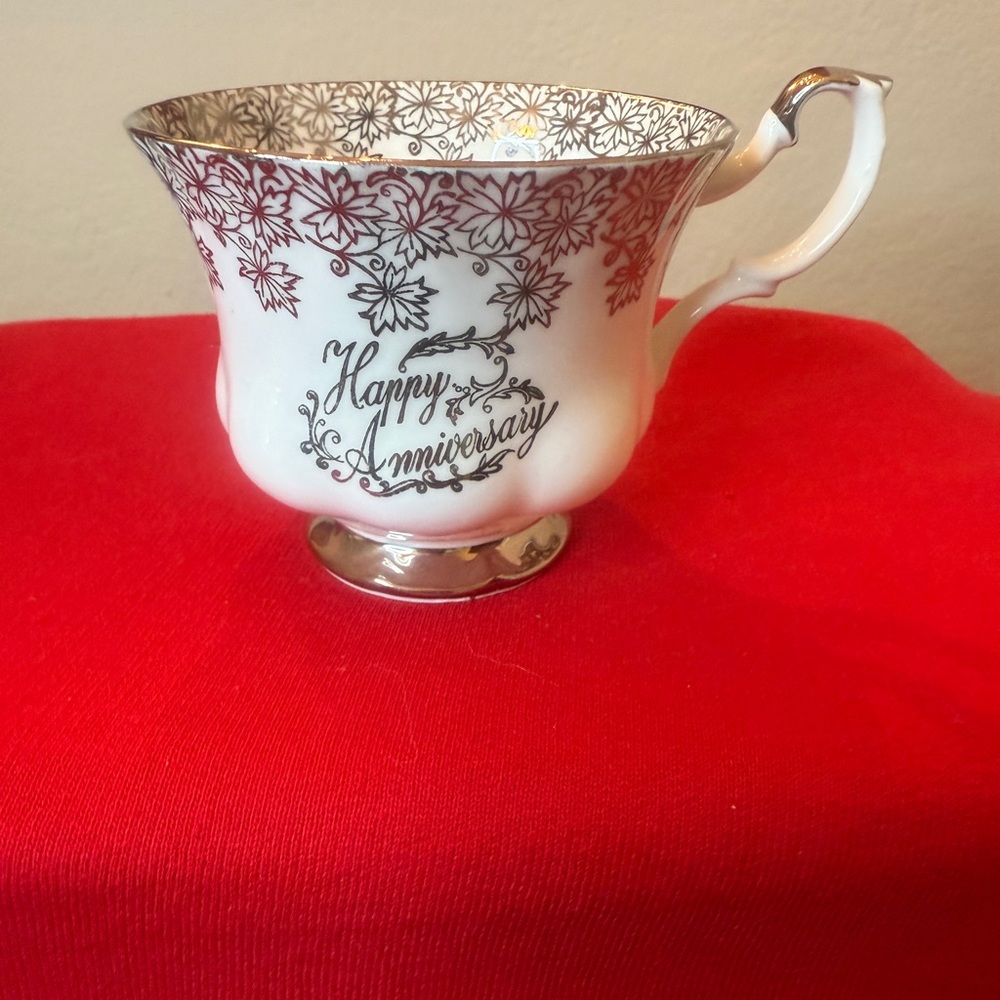 Royal Albert Bone China of England Teacup with gold base and trim. Pristine.